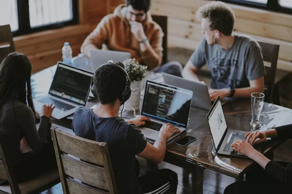 Aptivix software development team collaborating in a modern Gurugram coworking office